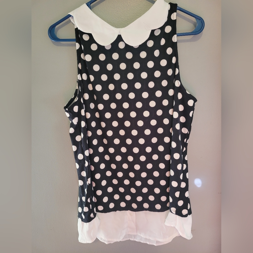 XL polka black and white polka dot sleeveless shirt with white collar.